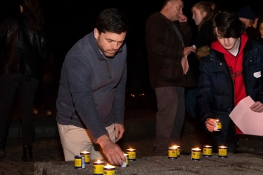 Stephen Crabb lighting a candle in memory of Holocaust victims 